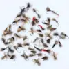Assortment of fishing flies with fluffy tails and colorful beads laid on a white background, ready for tying or use in fly fishing