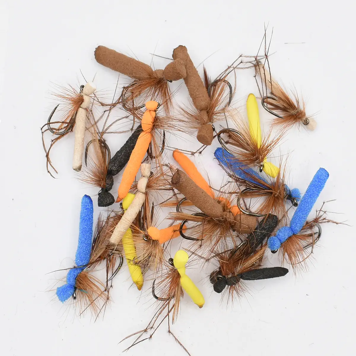 Assortment of colorful fly fishing lures with foam bodies in orange, yellow, and blue, and brown feather tails with hooks.