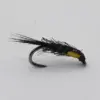 Black streamer fishing fly with long feather tails and yellow tag on a curved hook (fly fishing lure)