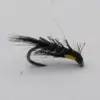 Artificial fishing fly with black hackle and a yellow head mounted on a curved hook against a white background, used as a lure for trout fishing.