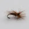 Close-up of a brown and tan fishing fly tied to a curved hook, with fluffy hackle fibers extending outward for lure