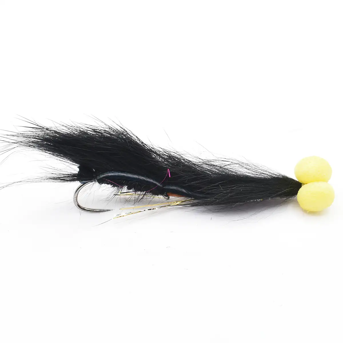 Fly fishing lure with a black hair body and two yellow beads at the tail, mounted on a curved hook