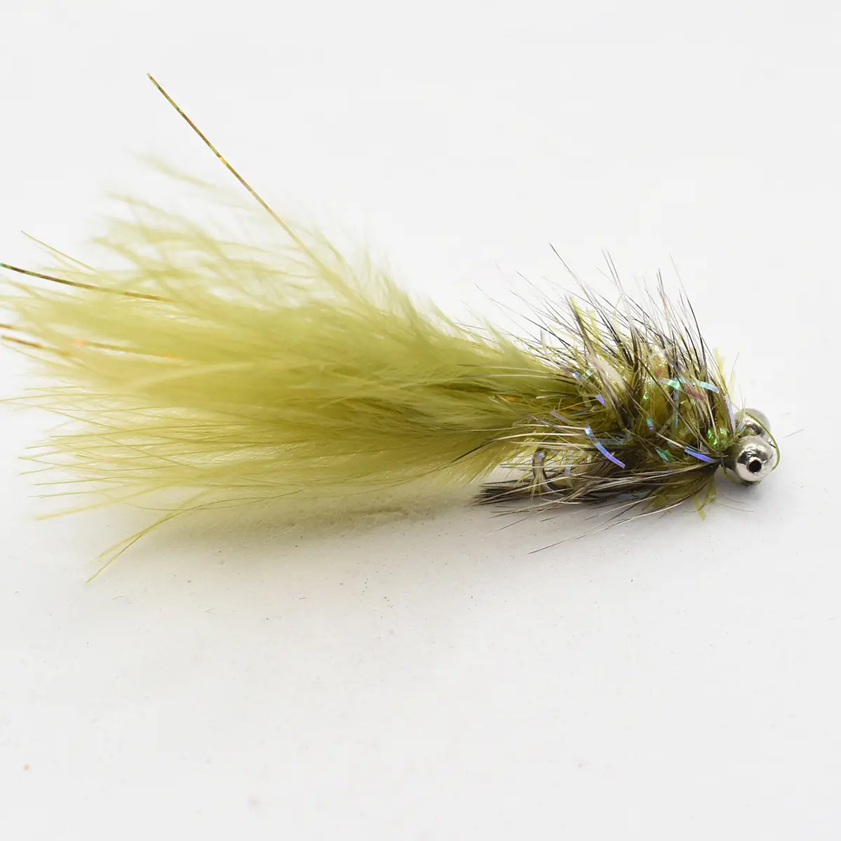 Artificial fishing fly lure with a fluffy yellow-green tail and iridescent strands, used for fly fishing.