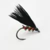 Black feathered fishing fly lure with a red beaded body on a curved hook used for fly fishing