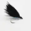 Black feathered fishing fly tied on a curved hook with a shiny blue-green ribbed body, used for fly fishing.