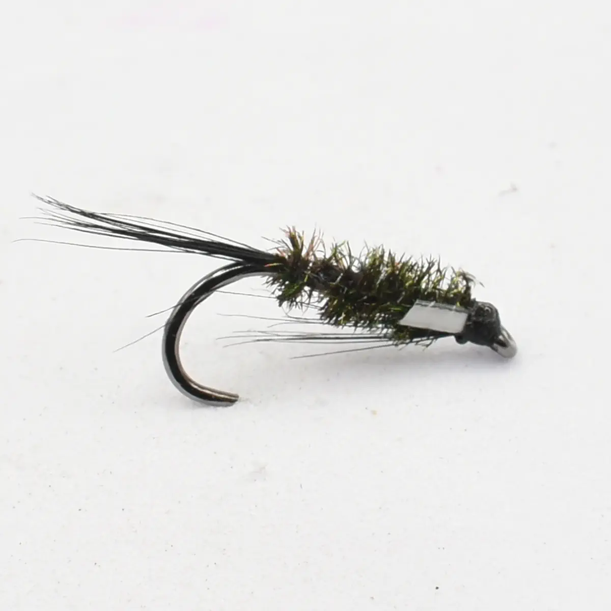 Close-up of a fly fishing lure: a small hook with an olive-green, fuzzy body and feather tail used to imitate insects.