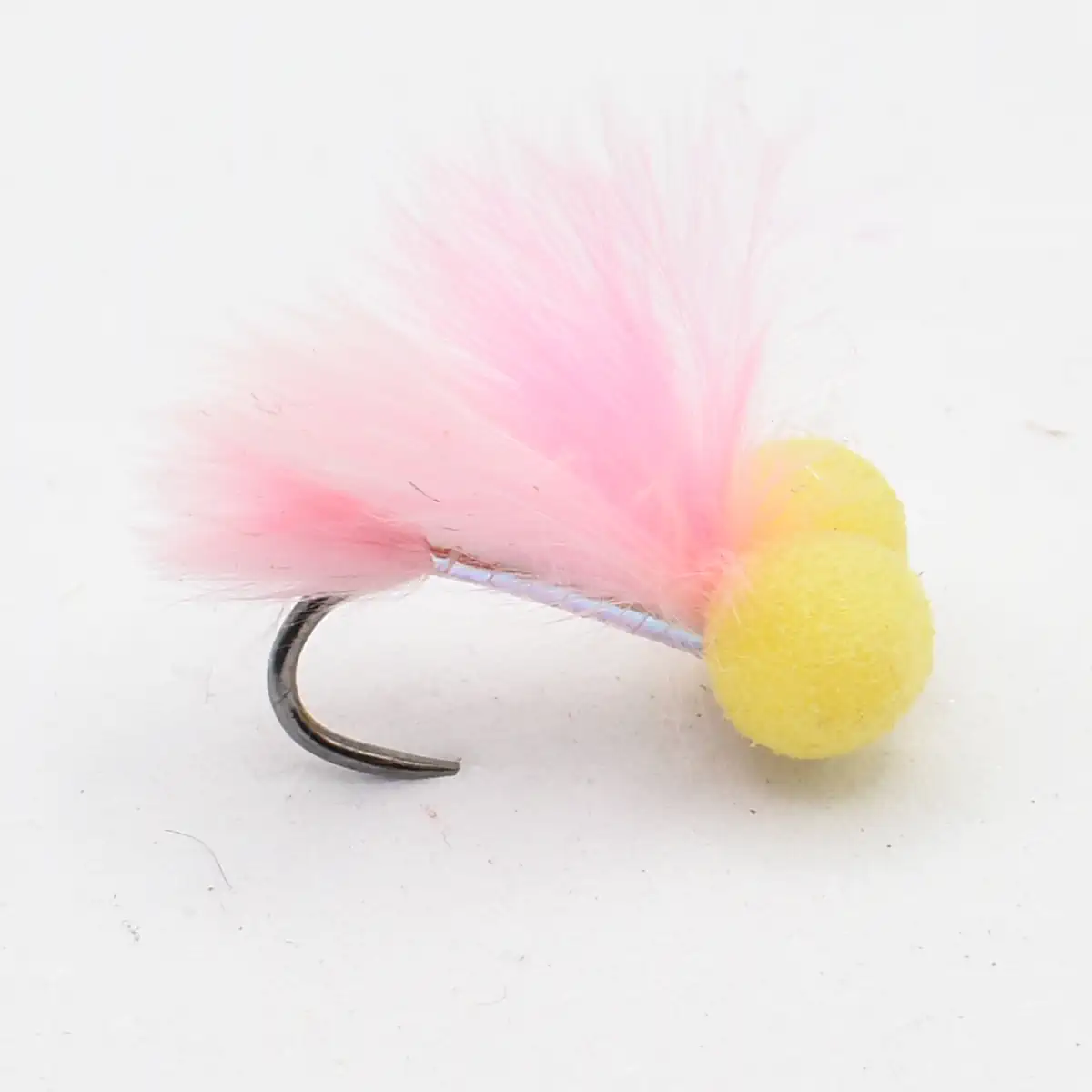 Pink feathered fly fishing lure with a yellow foam bead on a curved hook