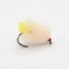 Close-up of a pale pink feather fishing fly with a yellow tail and red bead head on a curved hook.