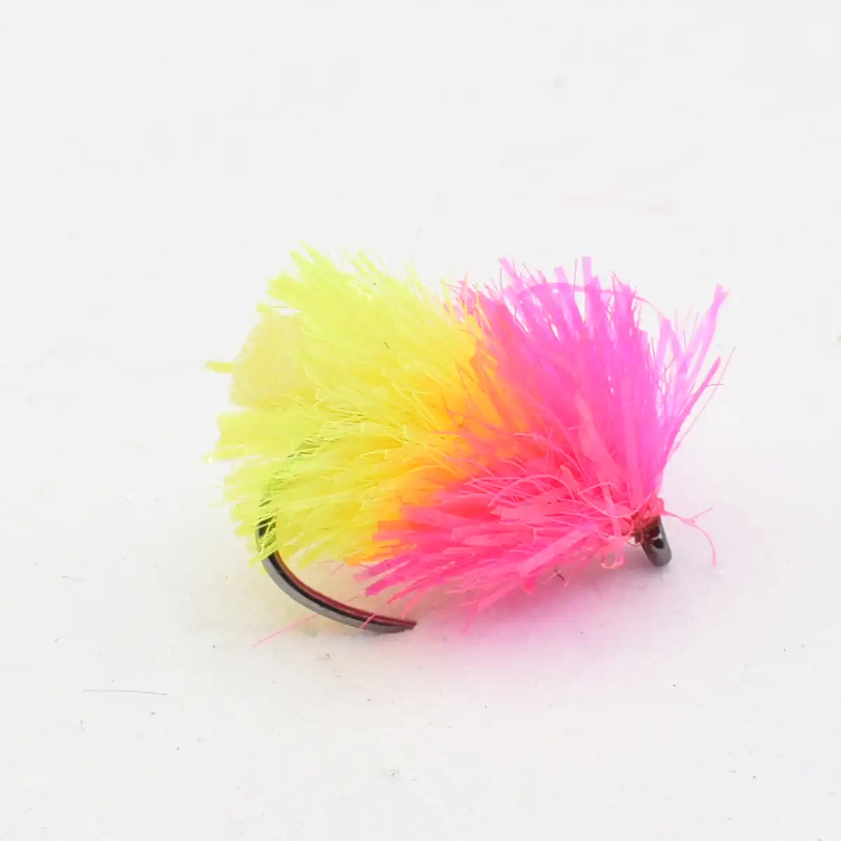 Bright pink and yellow feathered fishing lure with a dark hook at the base. Used to attract fish.