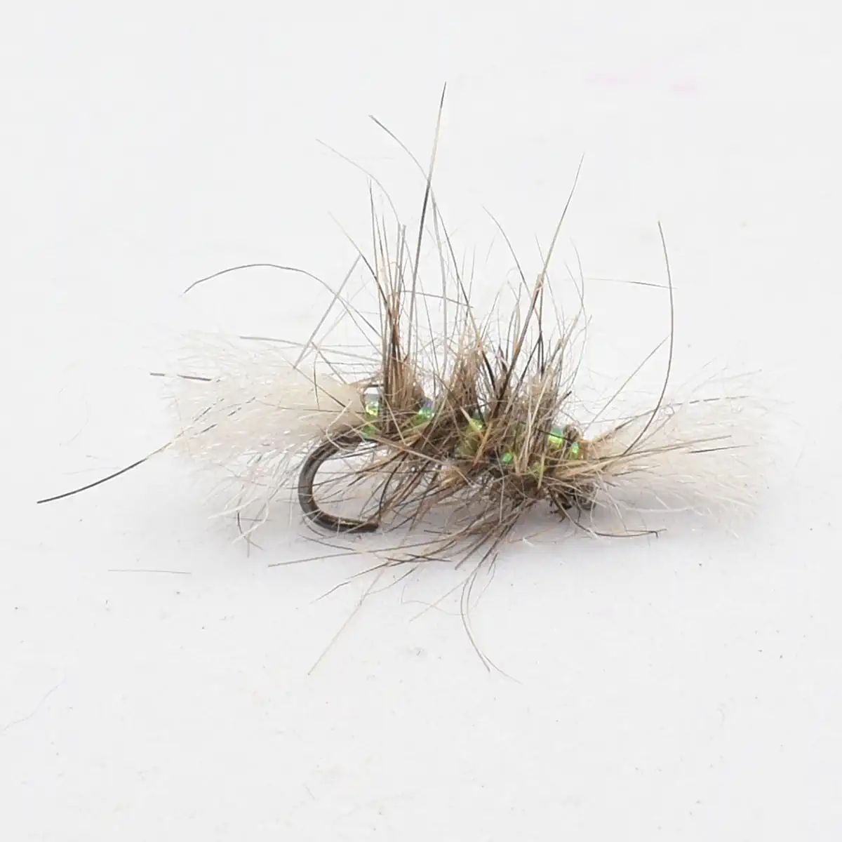 Fly fishing lure with brown and white hair, metallic beads, on a curved hook.
