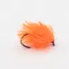 Orange fluffy fishing lure with a dark hook, used for fly or jig fishing on a white background.