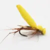 Yellow foam-bodied fishing fly with brown feather tail on a curved hook, used for fly fishing.