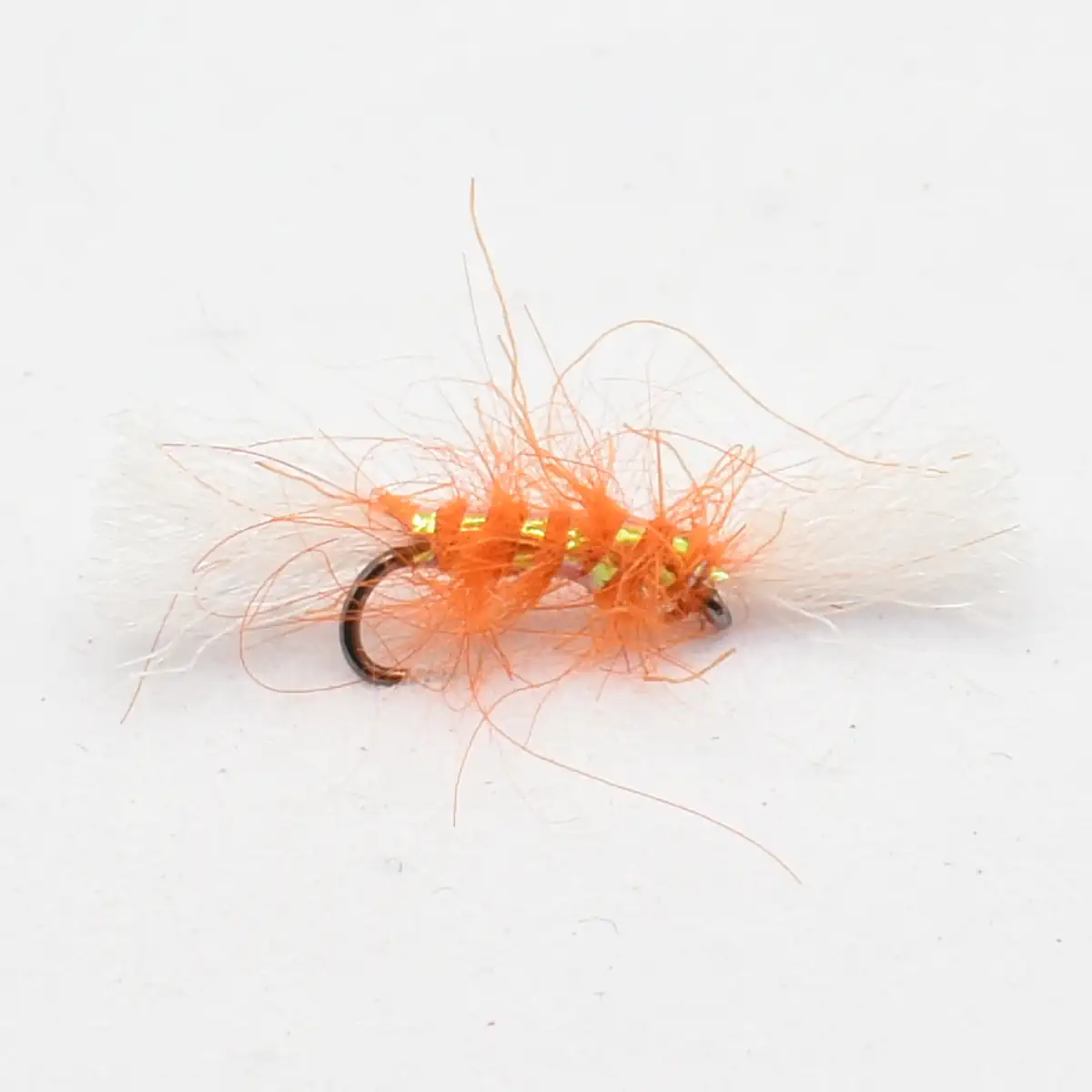 Orange fluffy fishing fly lure with metallic beads and a curved hook, used for fly fishing