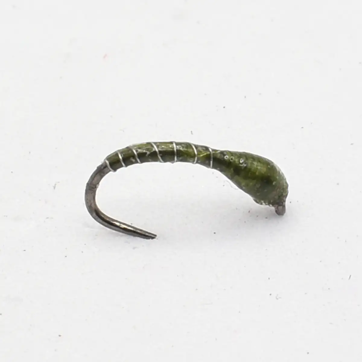 Green curly-tailed fishing lure with a curved hook