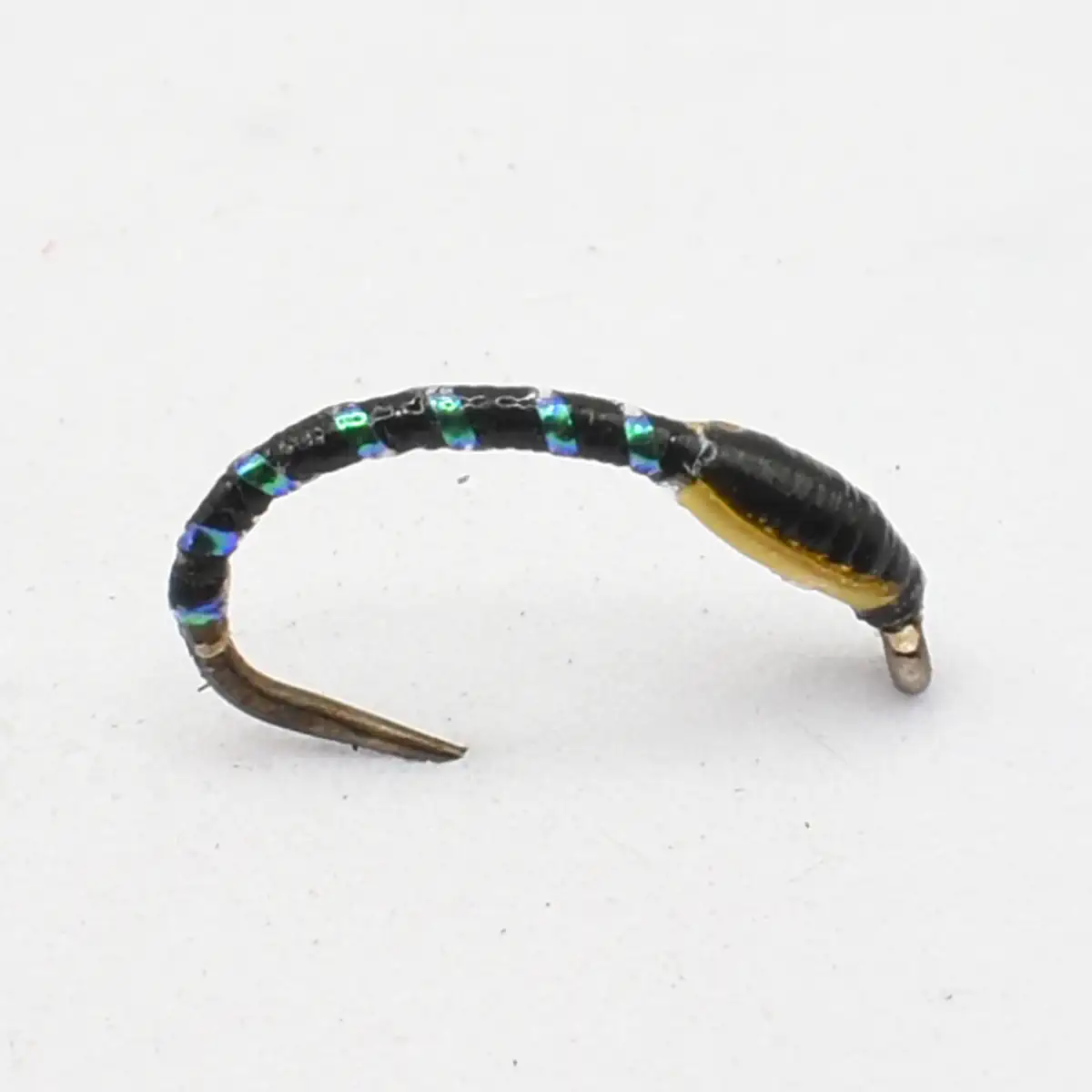 Small curved hoop earring wrapped in black thread with iridescent blue-green beads and a metal post nearby.
