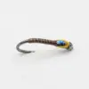 Artificial fishing lure with a brown striped body, yellow head, and a curved hook on the left; mimics a larva.