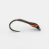 Single metallic fishing hook with brown wrapped thread and orange-wrapped grip section on a light background, ready for use in fishing.