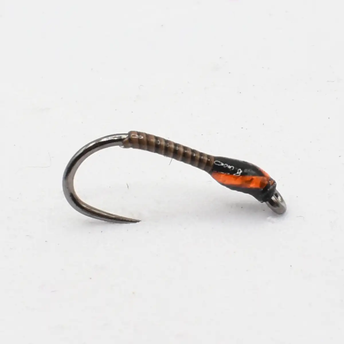 Single metallic fishing hook with brown wrapped thread and orange-wrapped grip section on a light background, ready for use in fishing.