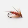 Red feathered fly fishing lure tied on a curved hook, used for trout fishing maneuvers.