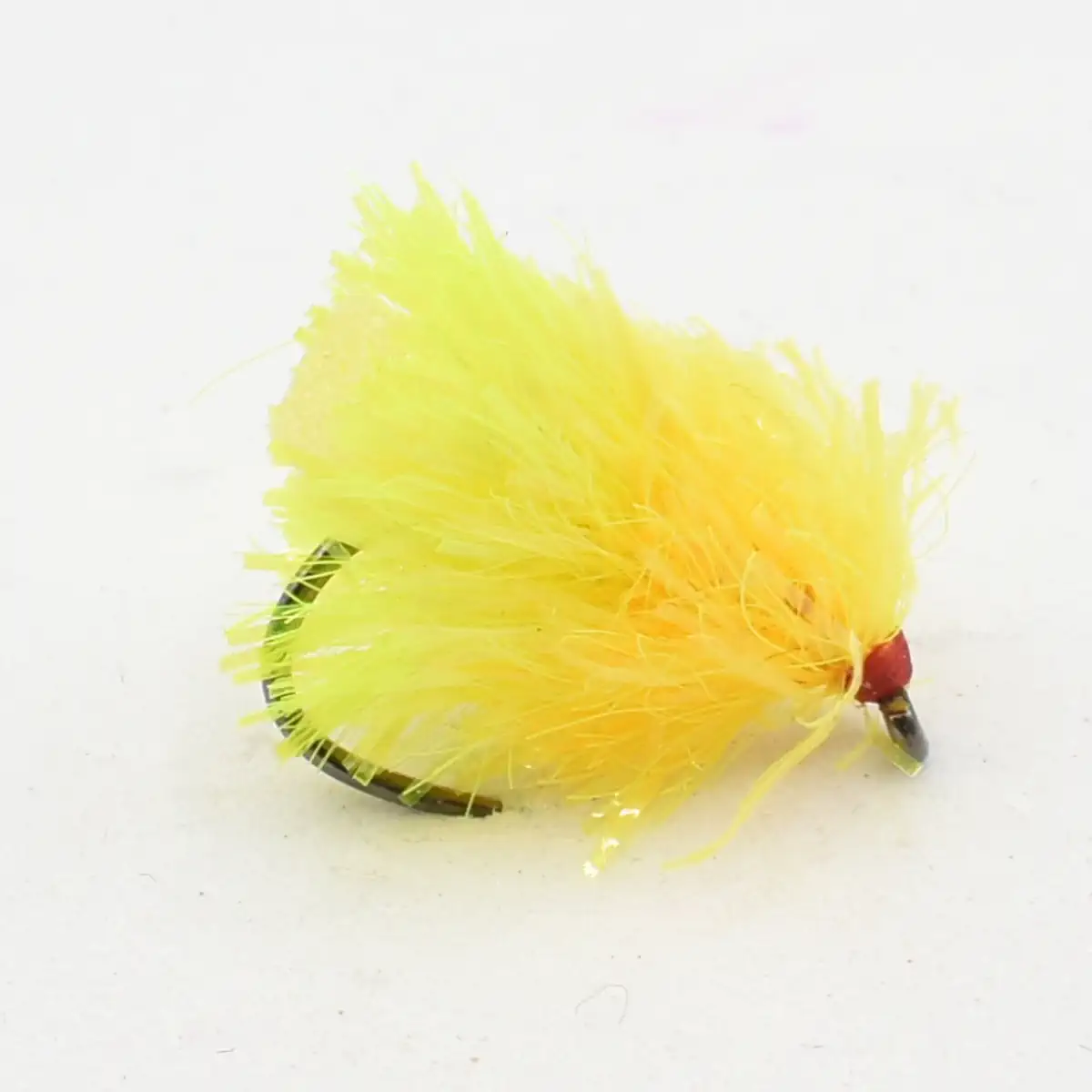 Bright yellow feathered fishing fly with a red head and hook, used as a lure in trout fishing