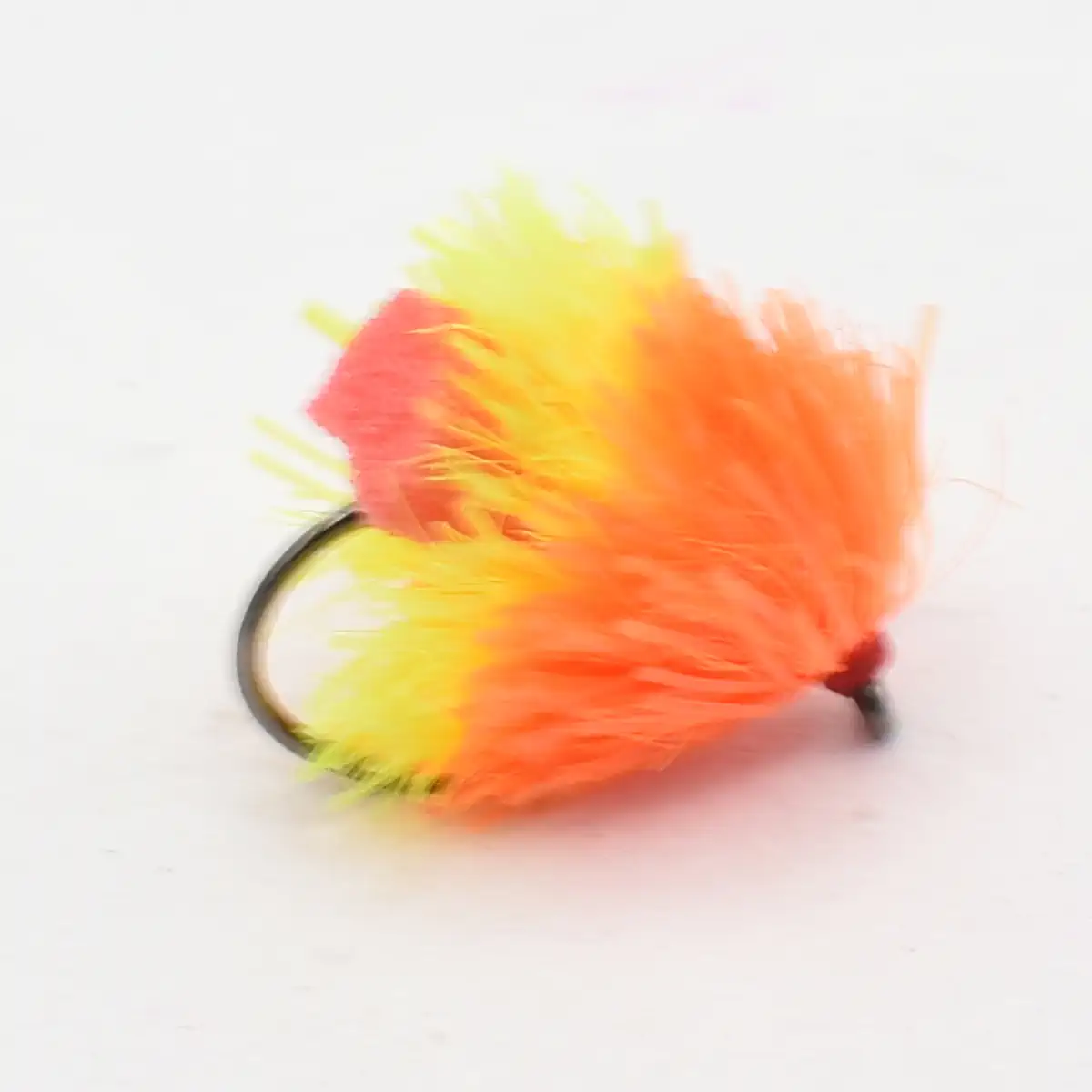 Bright orange and yellow feathered fishing lure attached to a dark hook used for fly fishing or fishing gear.