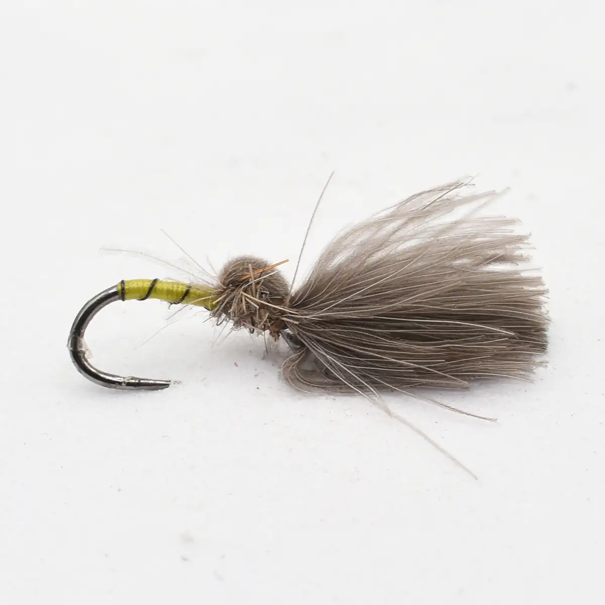 Gray fluffy dry fly fishing lure with a curved hook, used for fly fishing.