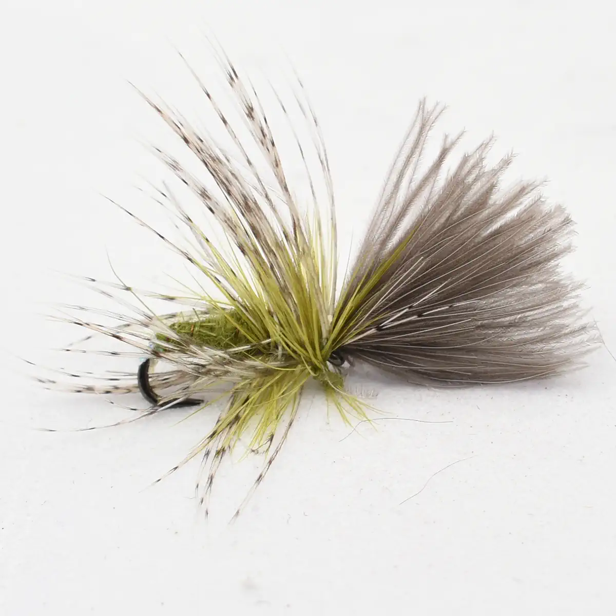 Fly fishing lure with olive-green and gray feather hackle and a visible hook tailing to the left.