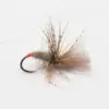 Floating dry fly with brown hackle and orange-thread head on a metal fishing hook