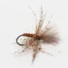 Close-up of a brown and tan fishing fly tied to a hook, with fluffy feather tail and hackle fibers