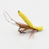 Close-up of a yellow foam-bodied fishing fly with brown feather tail used in fly fishing.