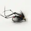 Close-up of a black fishing fly lure with white feather hackle used for trout fishing