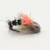Colorful fly fishing lure lying on its side: black body with green metallic bands, pink fuzzy hackle, and brown feathered tail.