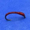 Red curved fishing hook with a black tip on a blue surface