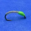 Artificial fishing lure: curved black hook with a green soft body on a blue surface.
