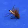 Artificial fishing fly with brown hackle and segmented beige body on a curved hook, lying on a blue background for fly fishing use.