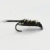 Close-up of a black, fuzzy fishing fly with a curved hook and small yellow bead accents, used as a fly fishing lure.