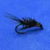 Close-up of a metallic green and black fishing fly with feathered hackle on a blue surface (artificial lure).