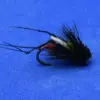 Fly fishing lure: black feathered wet fly on a blue background