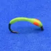 Green curved soft plastic fishing lure with an orange spot and a black hooked end on a blue background.