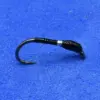 Small black fishing hook with a curved shape resting on blue fabric.