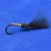 Fishing fly lure with striped body, dark hackle tail, and a curved hook on a blue background