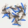Collection of blue-foam fishing flies with brown hackle tied on hooks for fly fishing.