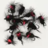 Assorted black and red fluffy fishing flies with hooks, arranged on a white background.