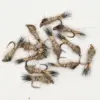 Assorted fishing flies tied with brown and tan feathers arranged on hooks.