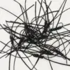 Mess of black leather cords with small black beads and metal clasps tangled on a white surface.