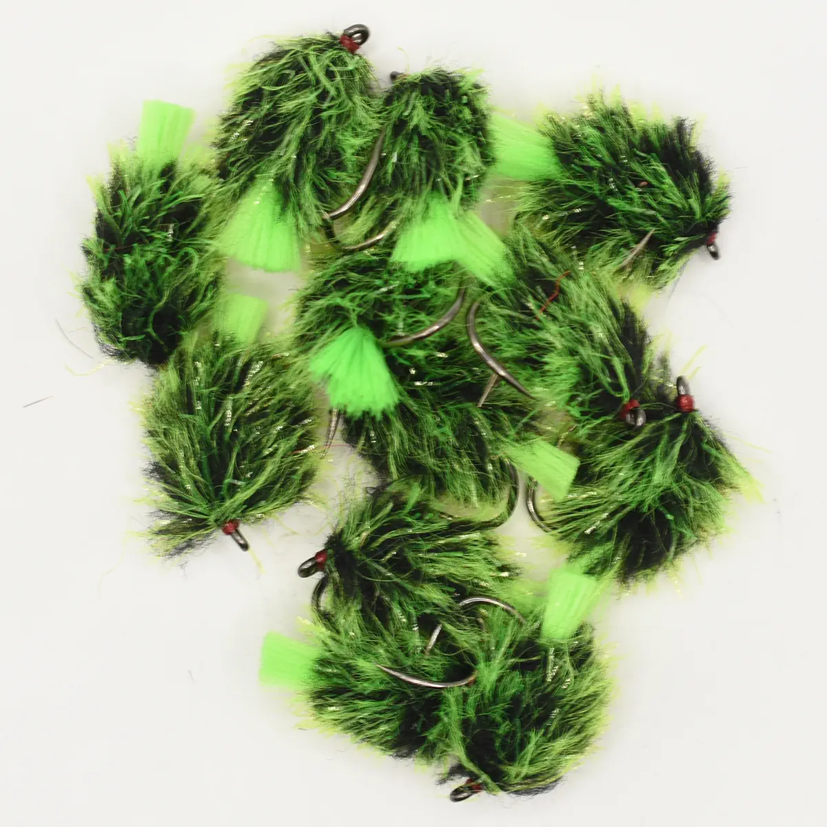 Assortment of bright green and black fuzzy fishing flies with metal hooks.