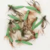 Assorted green foam-bodied fishing flies with brown hackle on hooks on a white background.