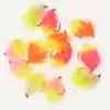 Assorted neon pink, yellow, and orange fluffy fishing flies with hooks on a white background
