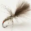 Close-up of a fishing fly lure tied to a metal hook with brown fur and feather fibers used for trout fishing